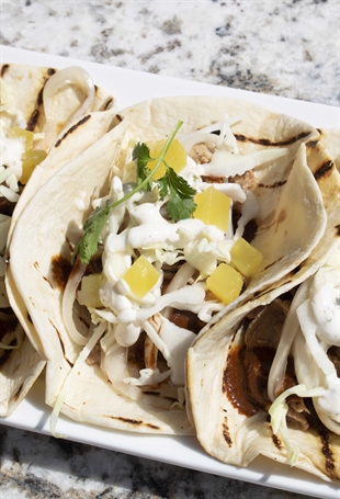 Chefs Pork Tacos with pickled pineapple and cilantro lime crema
