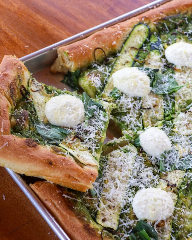 Inspired by the flavours of summer, this fresh-from-the-garden pizza features a creamy zucchini base, bright lemon ricotta and a golden sheet pan crust. Its a vibrant and satisfying recipe you can easily recreate at home.Find the recipe by visiting the link in our bio!#foodiefriday #pizzatime